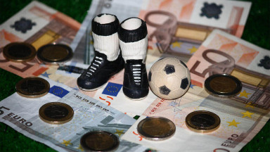 Photograph depicting money involved in football