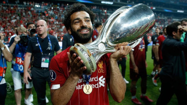 Salah holding the UEFA Super Cup after Liverpool beat Chelsea on penalties